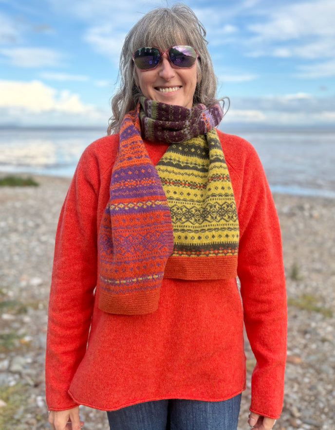 woman wearing fair isle autumn toned wool scarf
