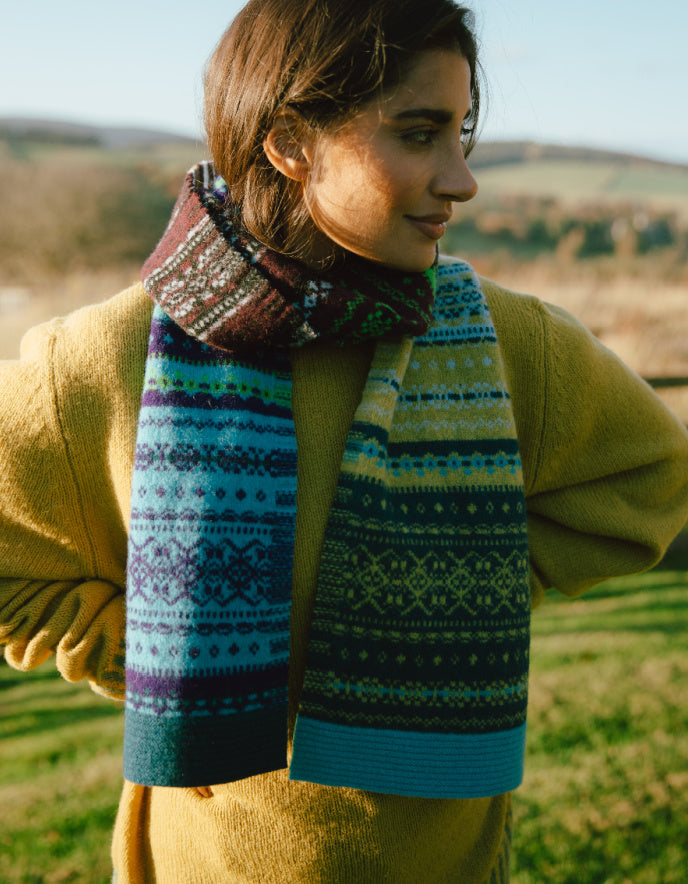 woman wearing fair isle autumn toned wool scarf