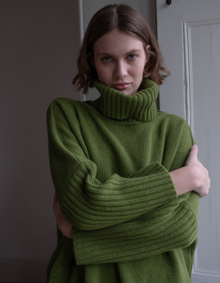 loose fit turtle neck oversized sweater in moss green made from merino lambswool