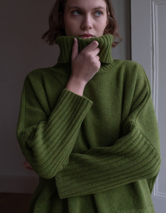 loose fit turtle neck oversized sweater in moss green made from merino lambswool