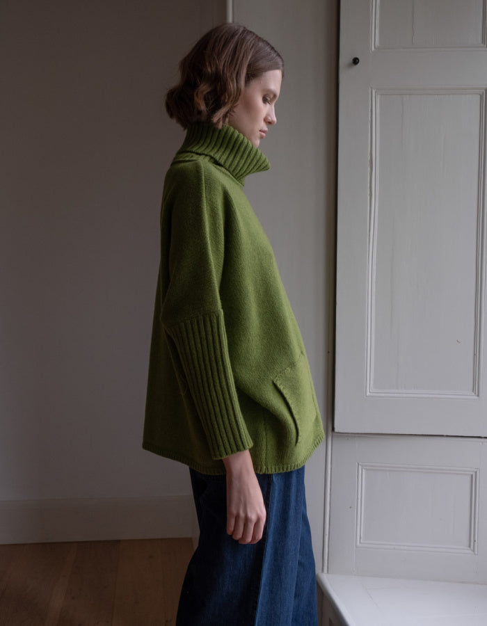 loose fit turtle neck oversized sweater in moss green made from merino lambswool