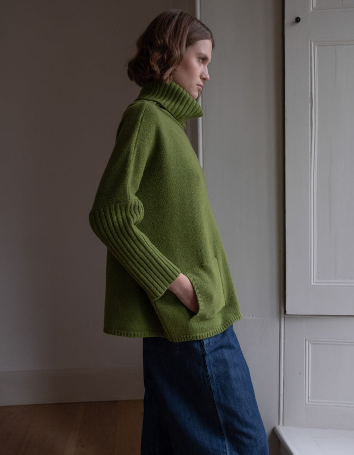 loose fit turtle neck oversized sweater in moss green made from merino lambswool