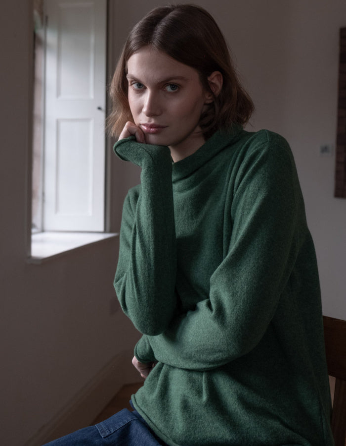 fine merino green jumper with turtle neck and long sleeves