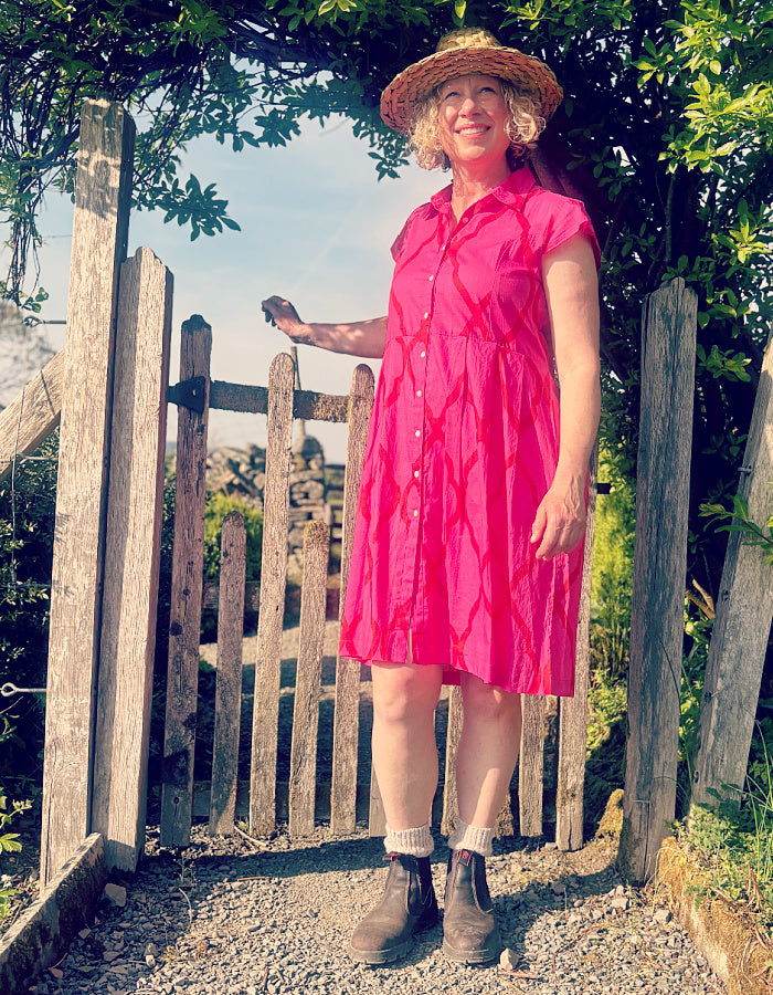 everyday shirt style knee length summer dress with capped sleeves in hot pink cotton with red details