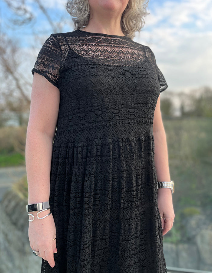 black lace midi length dress with underslip and capped sleeves