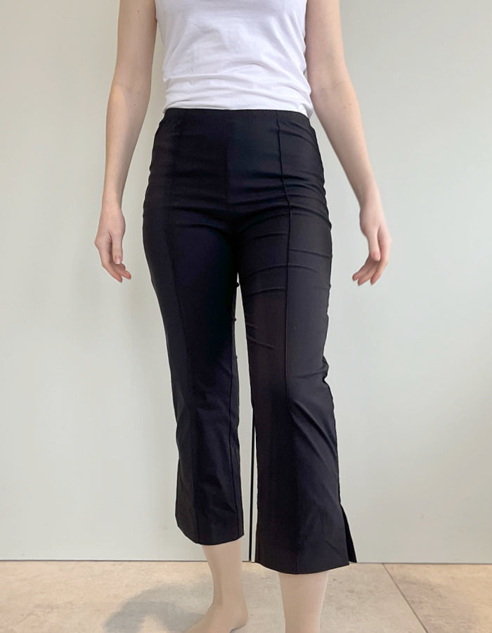 stretch black trapeze fabric trousers with 7/8ths length and size split hem