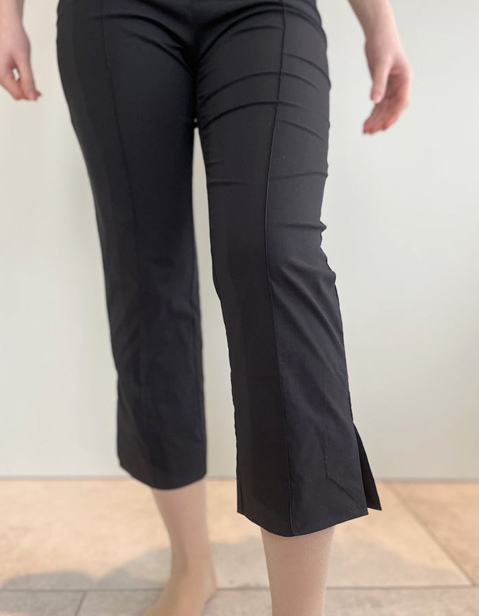 stretch black trapeze fabric trousers with 7/8ths length and size split hem