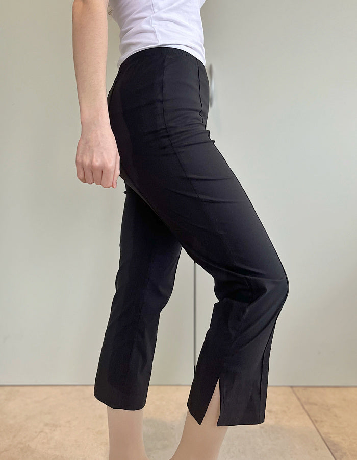 stretch black trapeze fabric trousers with 7/8ths length and size split hem