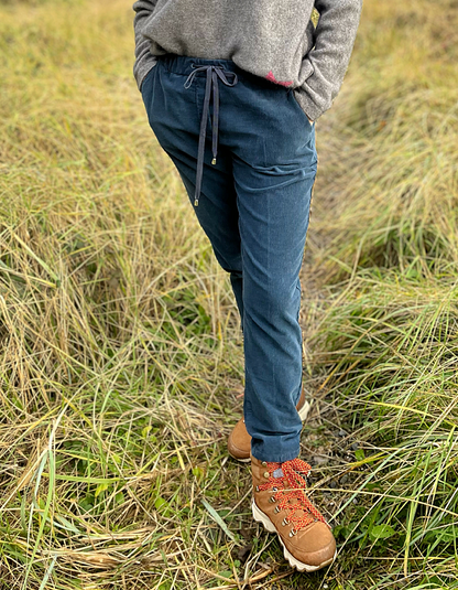 needlecord jogging style trouser with elasticated waist and drawstring toggle ties and side pockets in denim blue