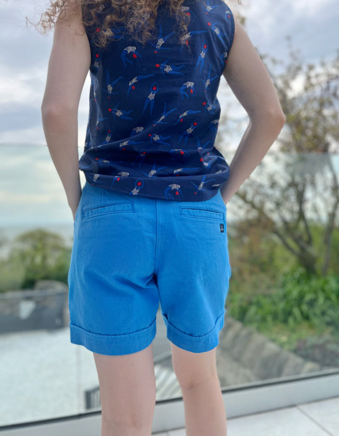 blue mid thigh length summer shorts with front and back pockets