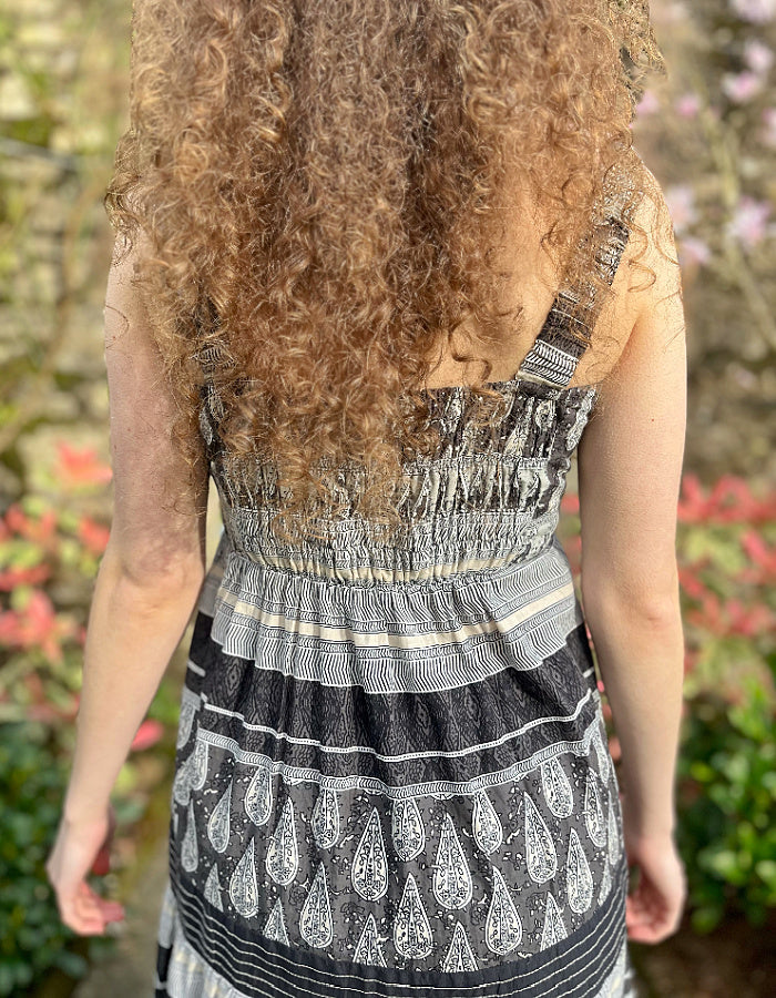 maxi length cotton sun dress with shoulder straps in black and stone stripe and paisley print