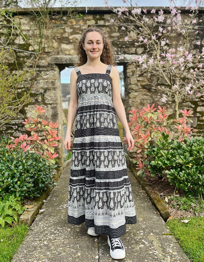 maxi length cotton sun dress with shoulder straps in black and stone stripe and paisley print