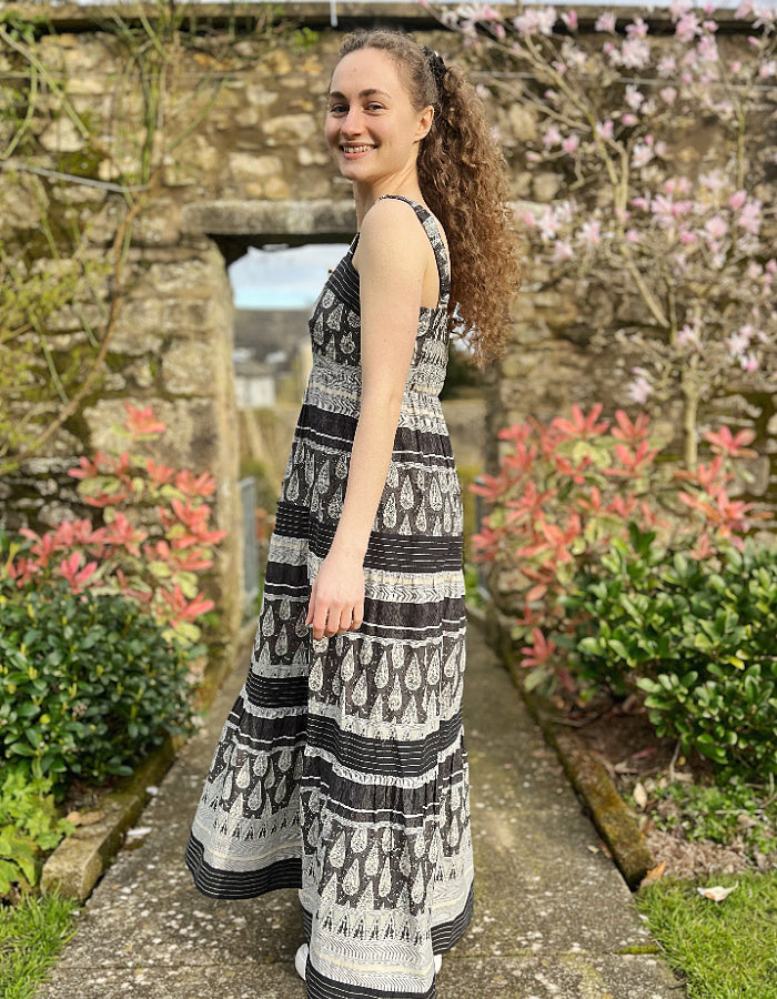 maxi length cotton sun dress with shoulder straps in black and stone stripe and paisley print