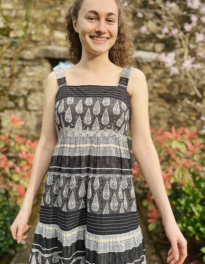 maxi length cotton sun dress with shoulder straps in black and stone stripe and paisley print