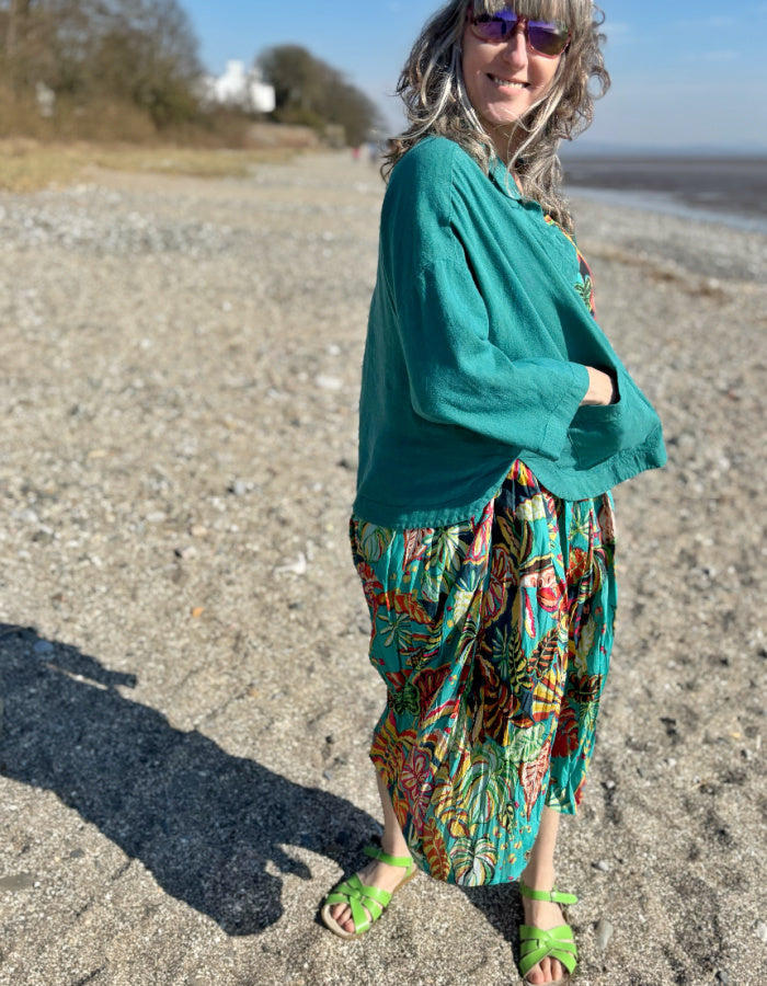 cotton sleeves midi length bubble dress with empire line. print in turquoise red and green tropical rainforest inspired