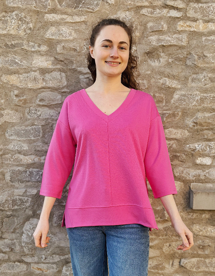 pink V neck sweatshirt with 3/4 length sleeves