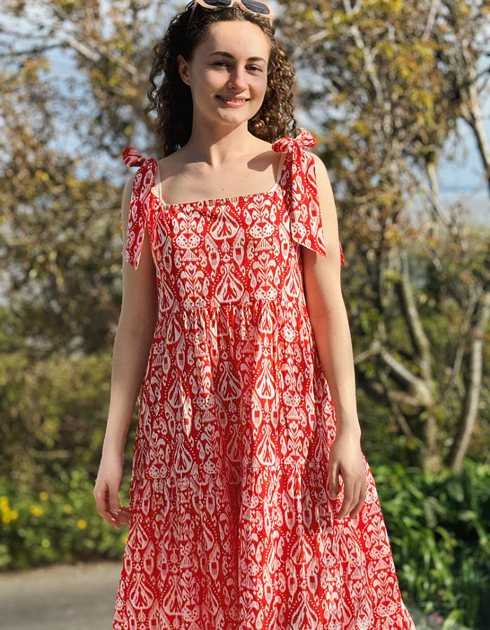 red and white hand block print cotton maxi dress with tie shoulder straps and a tiered skirt