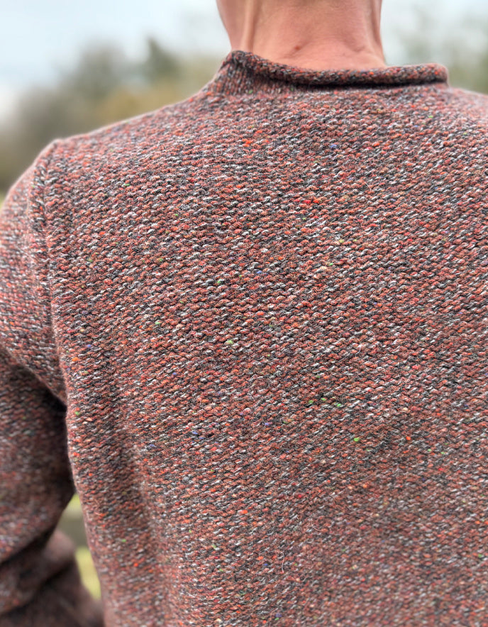Close-up of a textured sweater with a blurred background