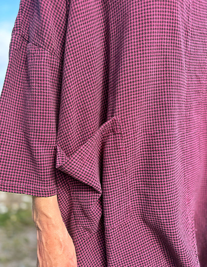 close up of burgundy and black mini check fabric