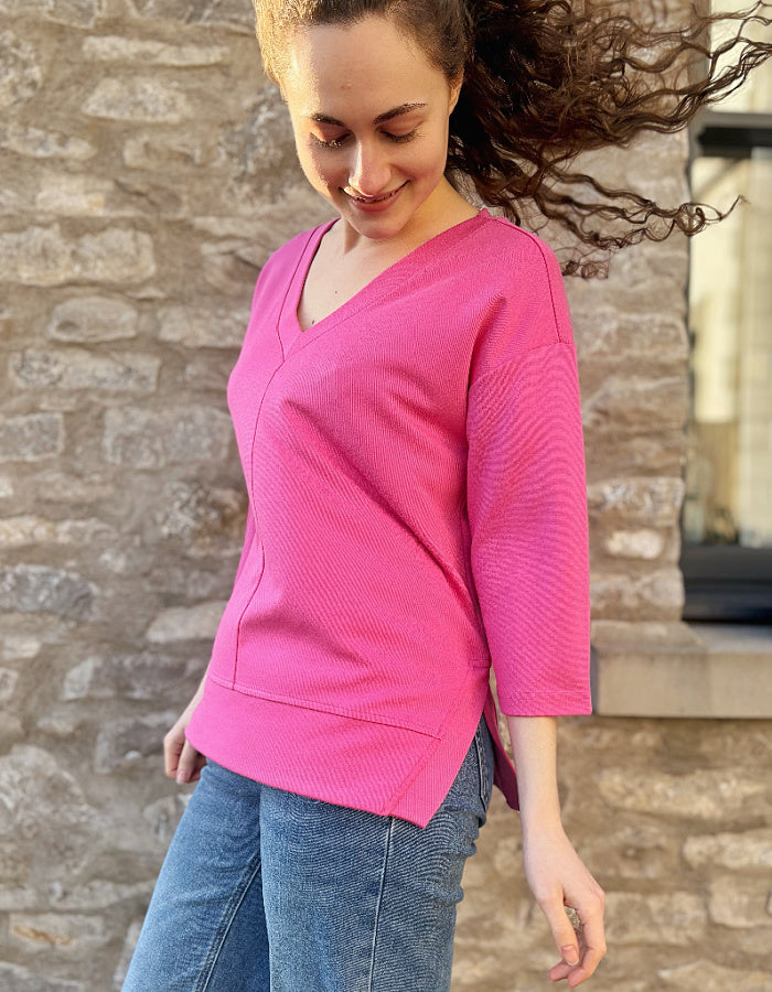 pink V neck sweatshirt with 3/4 length sleeves