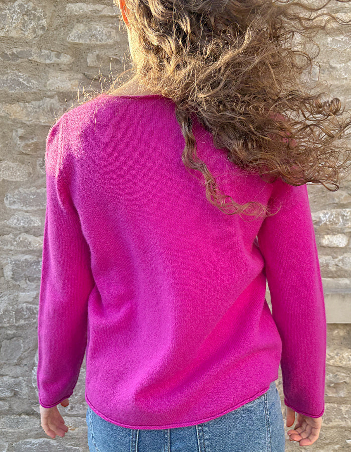 honesty pink short boxy woollen sweater with round neckline and long sleeves, made from merino lambswool