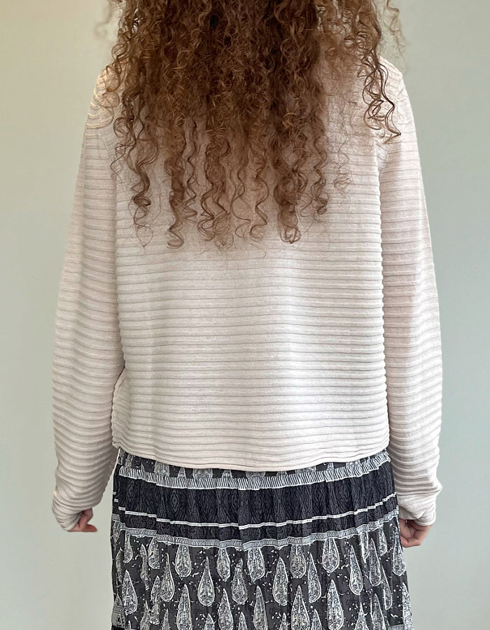 short wide boxy cardigan with ribbed texture, long sleeves and scoop neck in cream