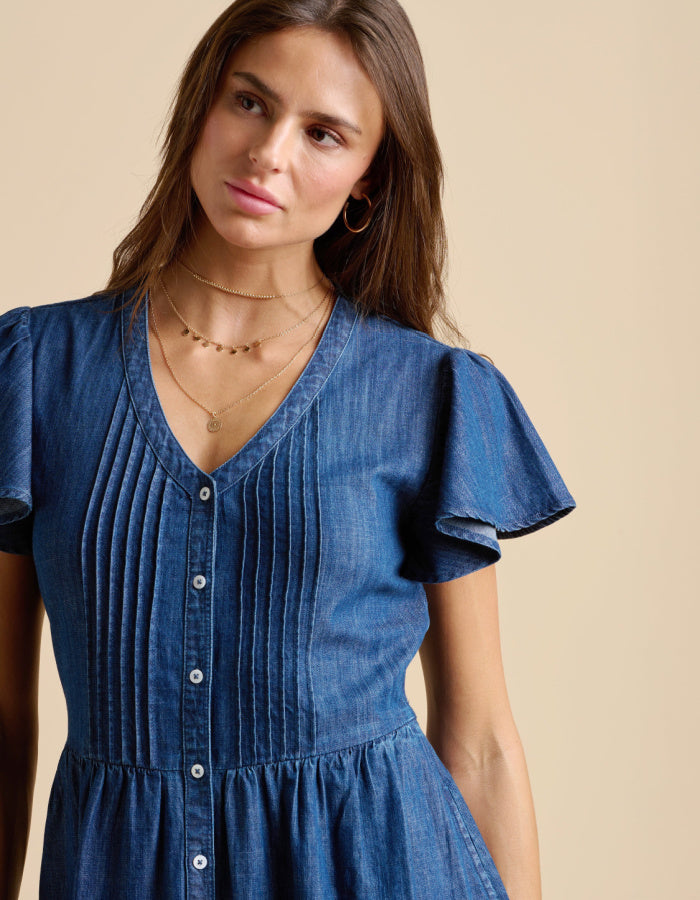 knee length denim dress with neckline, button through at the front and fluted sleeves, gathered waist. everyday dress