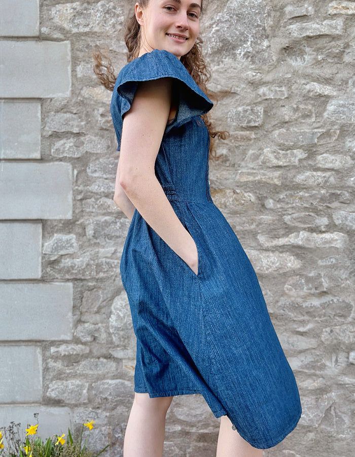 knee length denim dress with neckline, button through at the front and fluted sleeves, gathered waist. everyday dress