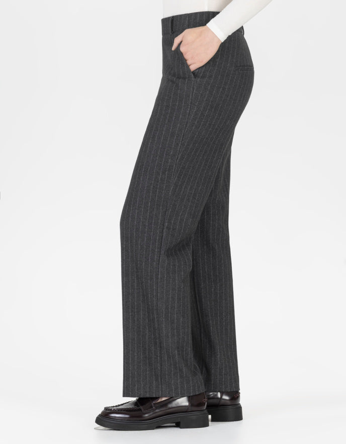 Grey pinstripe pants worn by a person on a white background