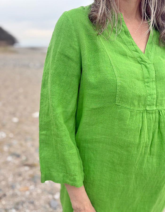 green linen tunic knee length with 3/4 length sleeves and V neck
