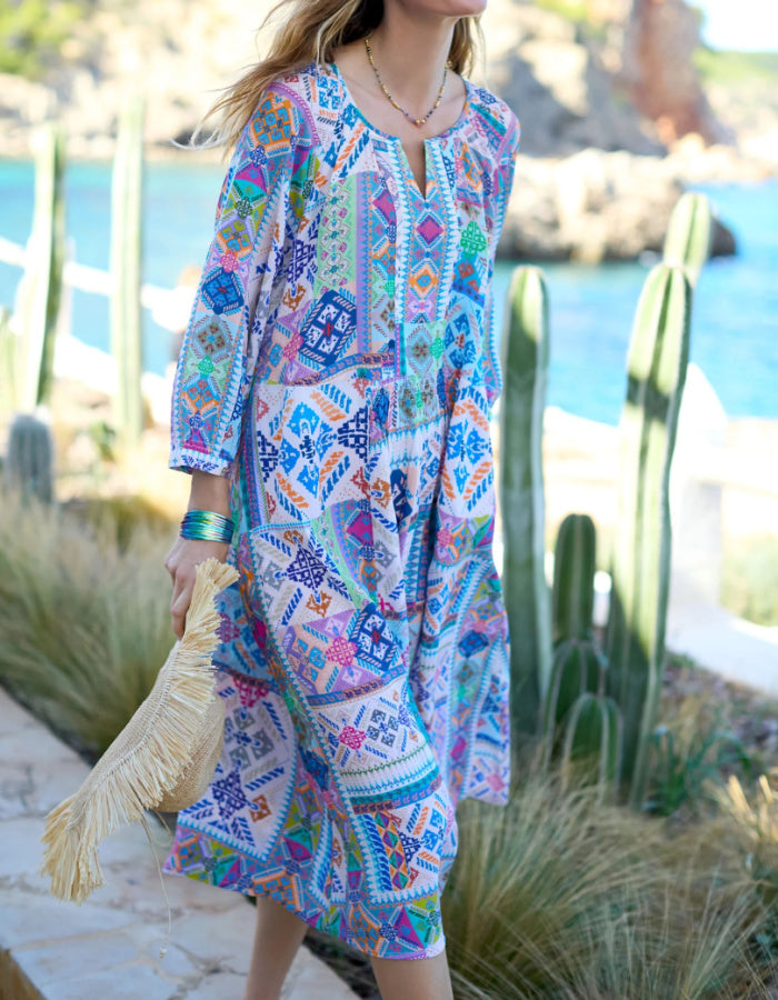 easy style loose fit summer dress with 3/4 length sleeves and a loose flow fit in a soft pastel bright patchwork print