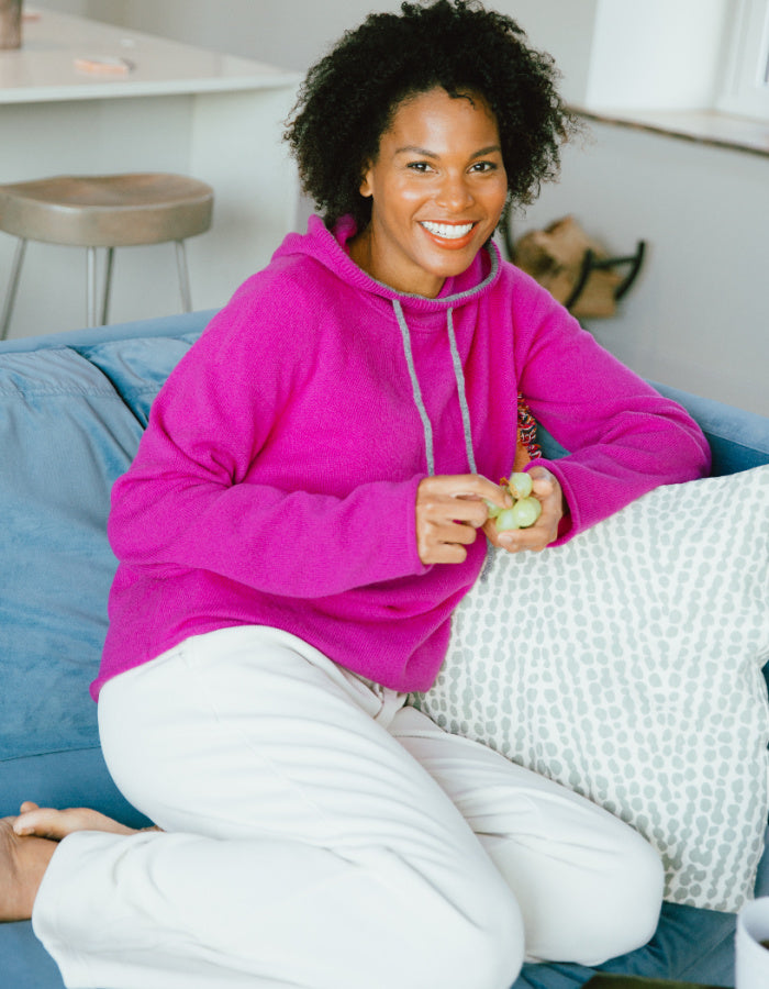 woman wearing pink lambswool hooded sweater