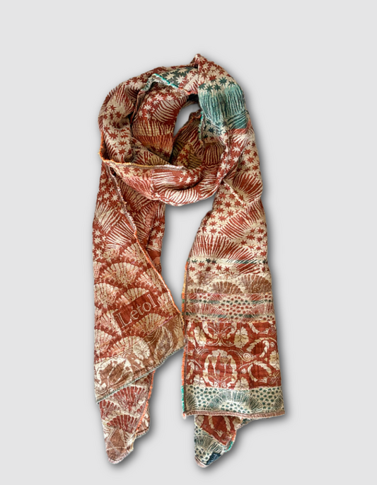 Patterned jacquard organic cotton scarf with star designs in terracotta, green and cream