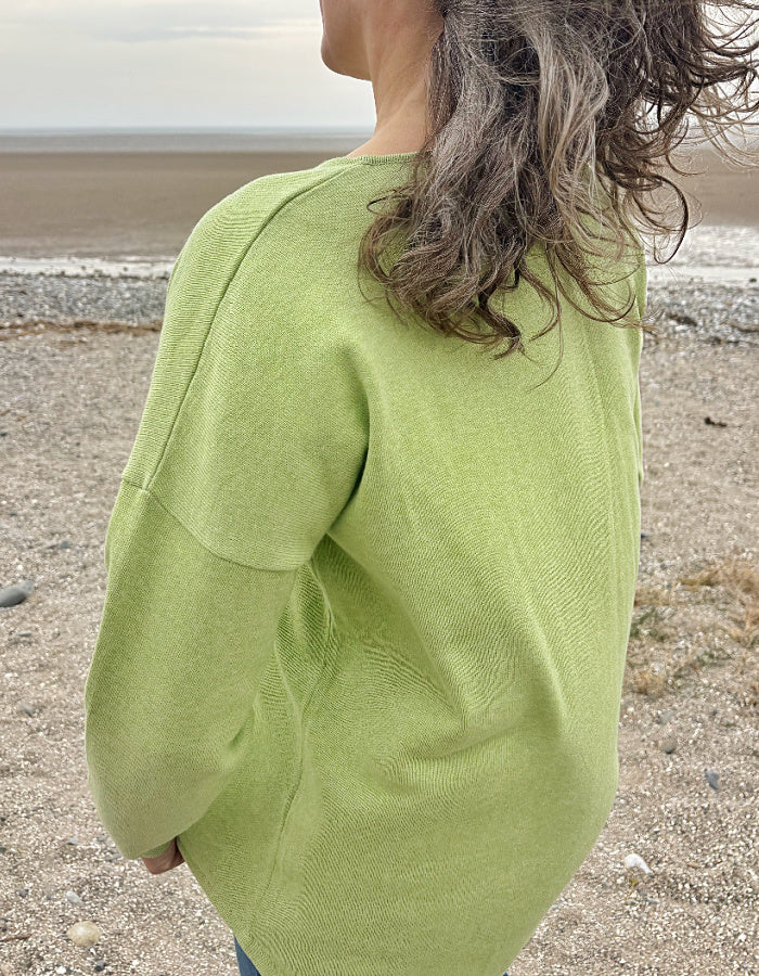 relax fit lime green cotton sweater with scoop neckline and high low hemline