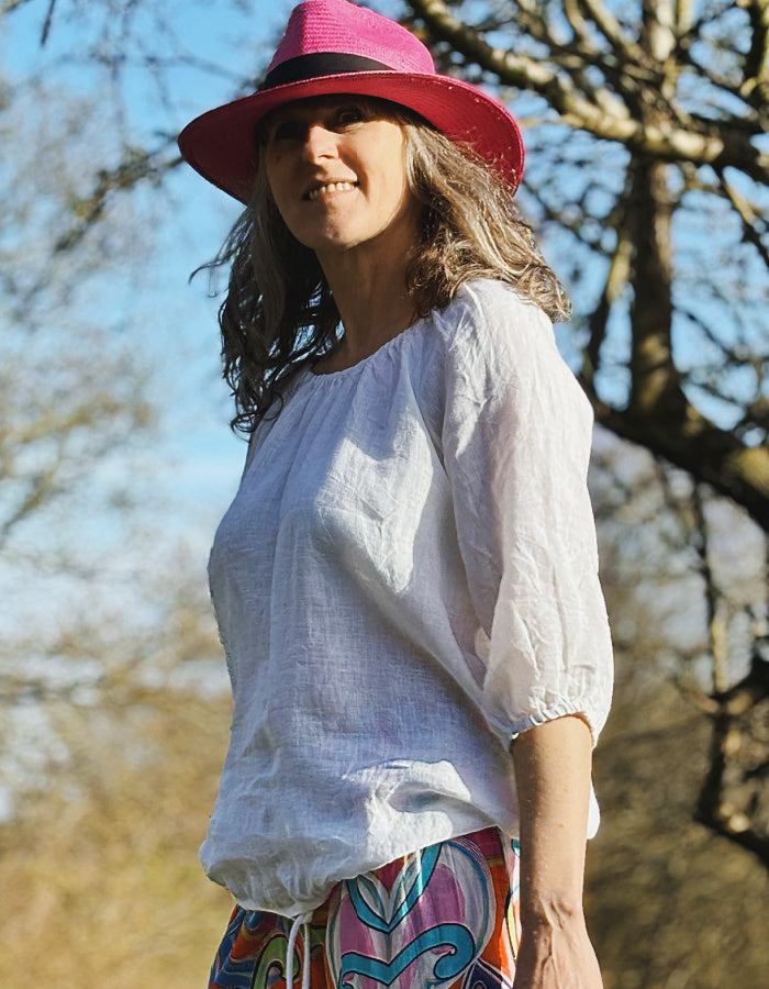 linen boho top with 3/4 sleeves and elasticated neckline to wear on off off the shoulder in white