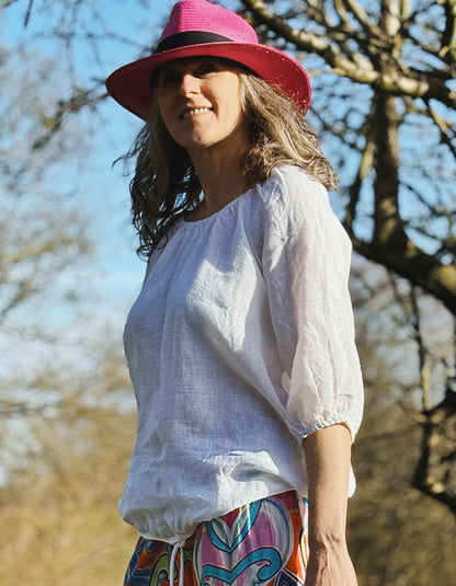 linen boho top with 3/4 sleeves and elasticated neckline to wear on off off the shoulder in white