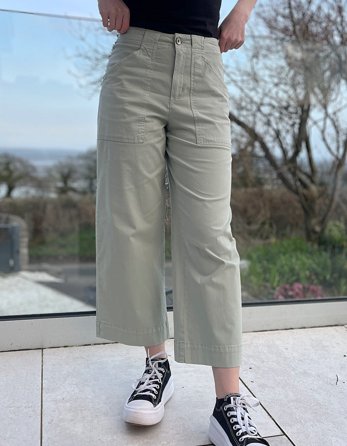 summer cotton twill culotte trousers with a wide leg and front and rear pockets in summer green