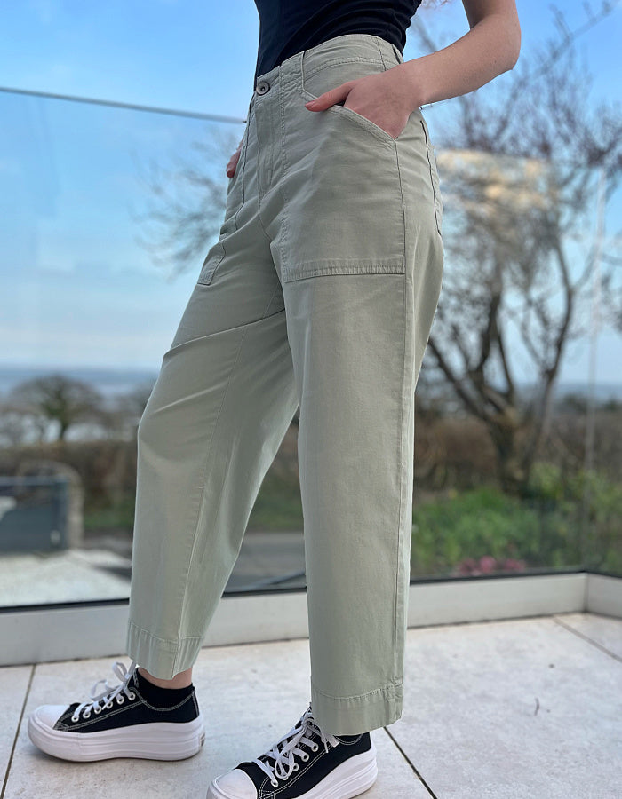 summer cotton twill culotte trousers with a wide leg and front and rear pockets in summer green