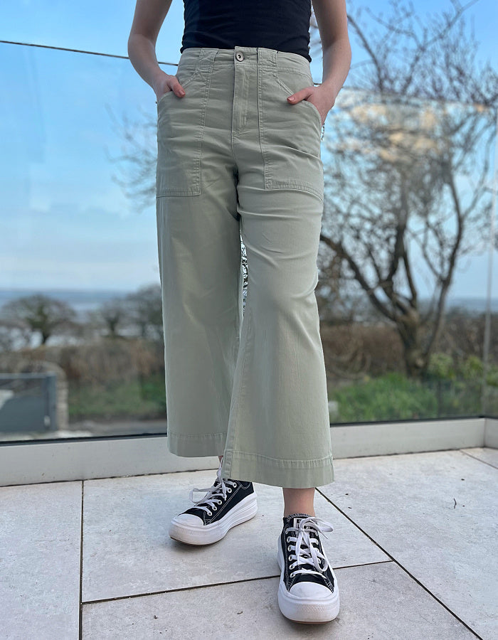 summer cotton twill culotte trousers with a wide leg and front and rear pockets in summer green