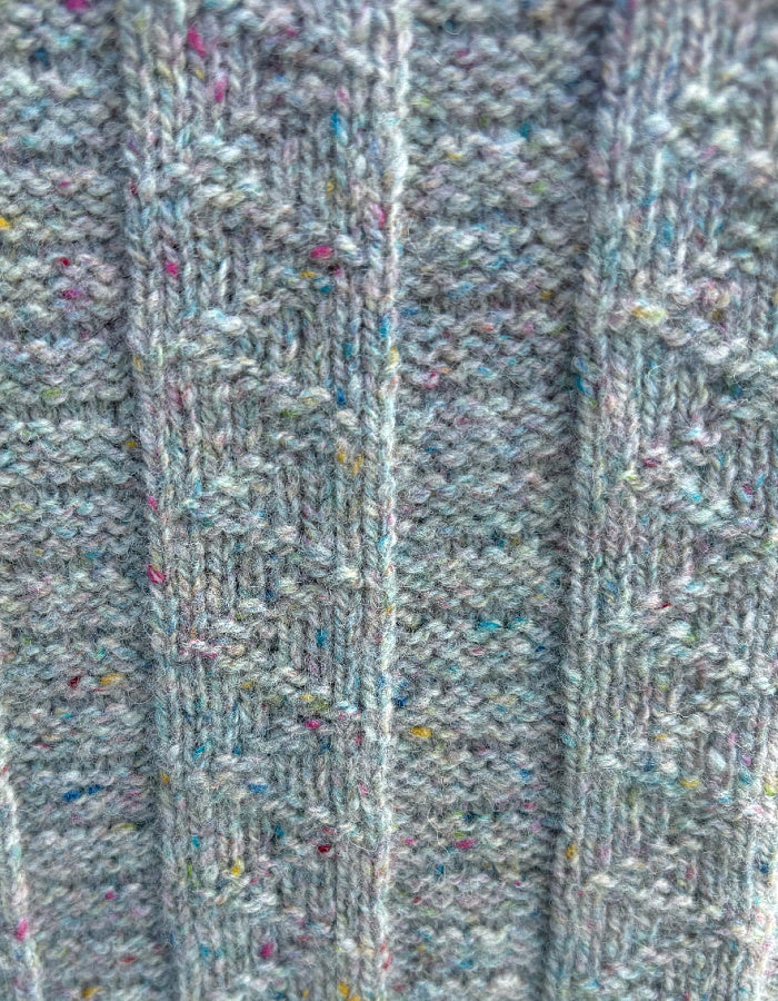 Close-up of textured fabric with a ribbed pattern