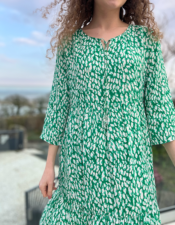 knee length loose fit summer dress in white and fresh green abstract print, 3/4 sleeves and frilled hemline