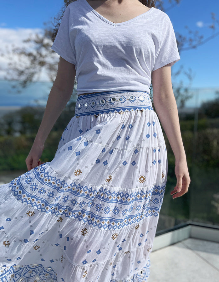 white cotton maxi skirt with blue and gold geo print with mirror details, elasticated waist