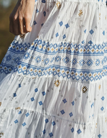 white cotton maxi skirt with blue and gold geo print with mirror details, elasticated waist