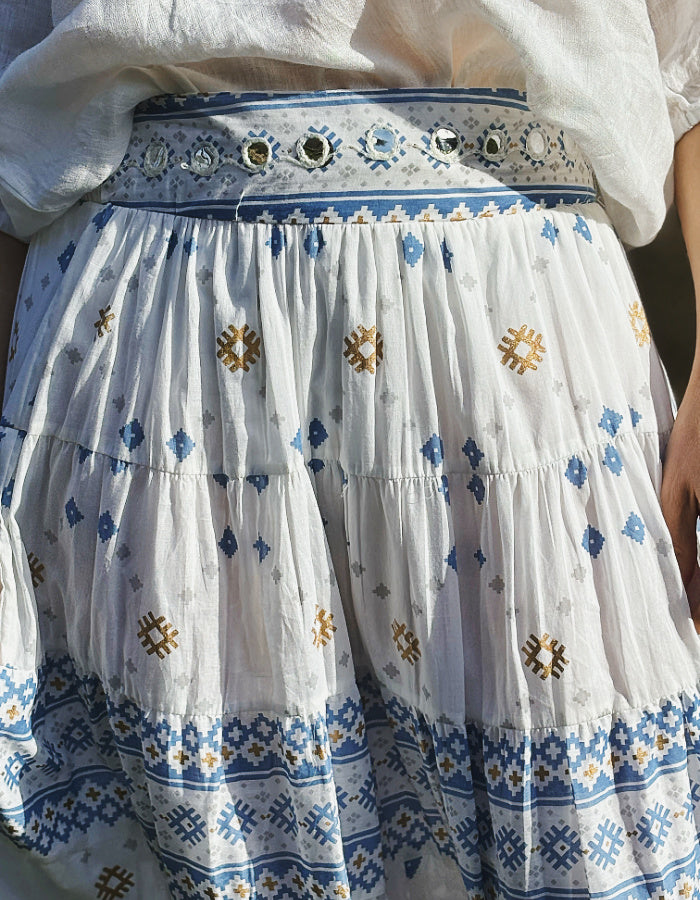 white cotton maxi skirt with blue and gold geo print with mirror details, elasticated waist