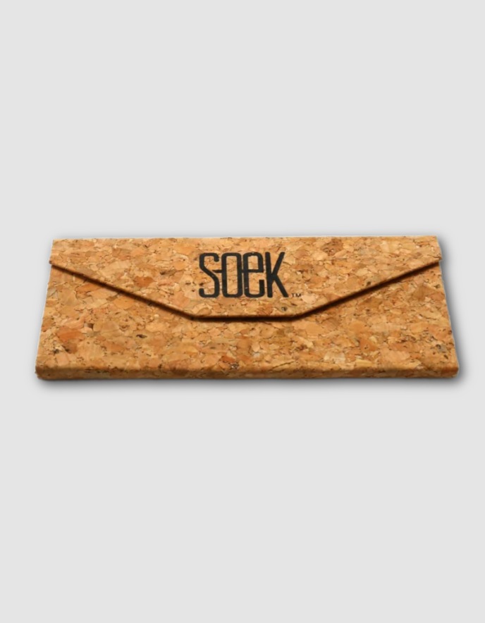 A rectangular cork-textured pouch or envelope-style case with a flap closure and the word 'soek' printed across the front, shown on a light gray background.