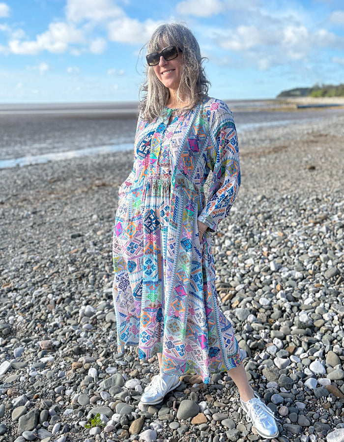 easy style loose fit summer dress with 3/4 length sleeves and a loose flow fit in a soft pastel bright