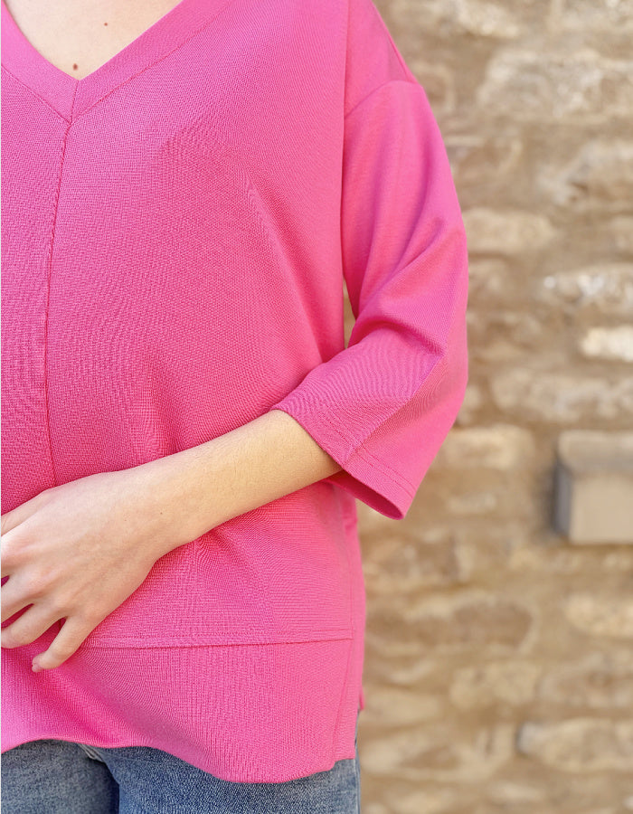 pink V neck sweatshirt with 3/4 length sleeves