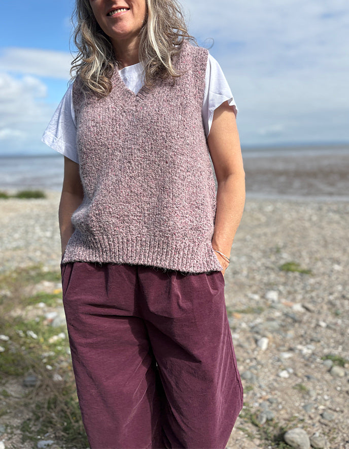 woman wearing tank top and burgundy lantern trousers
