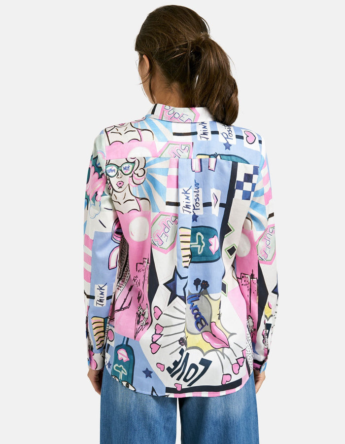 Person wearing a colorful patterned shirt on a white background