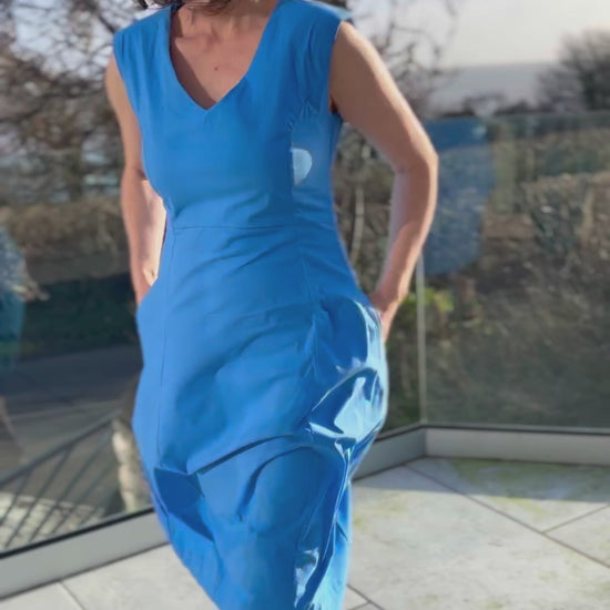 stretchy trapeze midi length bubble dress with v neckline and sleeveless design in stunning cornflower blue colour